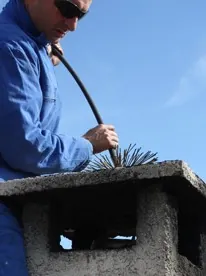 Man Cleaning Chimney, Chimney Sweeps in Ashford, Kent